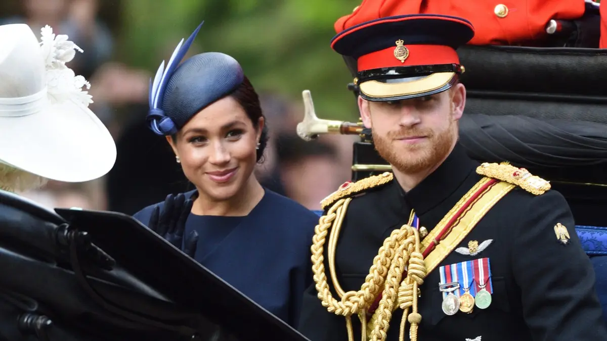 Meghan Duchess of Sussex and Prince Harry Duke of Sussex standing at Trooping The Colour ceremony
