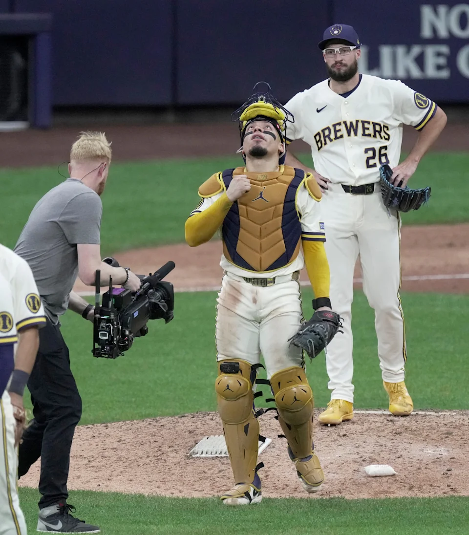 Milwaukee Brewers catcher William Contreras (24) reacts after their NLCS game as pitcher Aaron Ashby (26) looks on Monday, Oct. 12, 2026 at American Family Field in Milwaukee, Wisconsin. The Milwaukee Brewers beat the Los Angeles Dodgers 7-4 to lead the series 2-0.