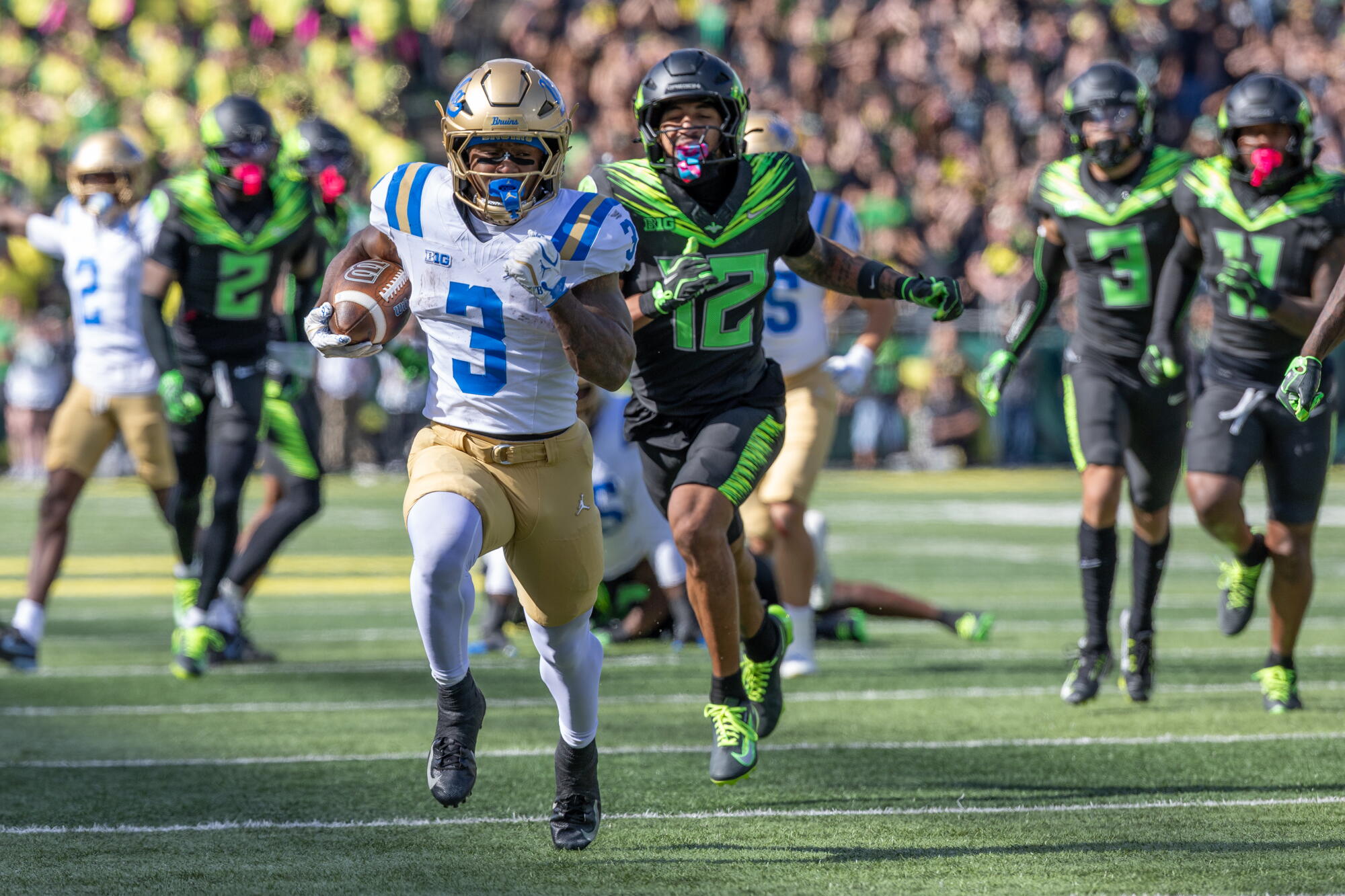 UCLA tailback Wayne Knight runs for a touchdown against Oregon Saturday at Autzen Stadium in Eugene, Ore.