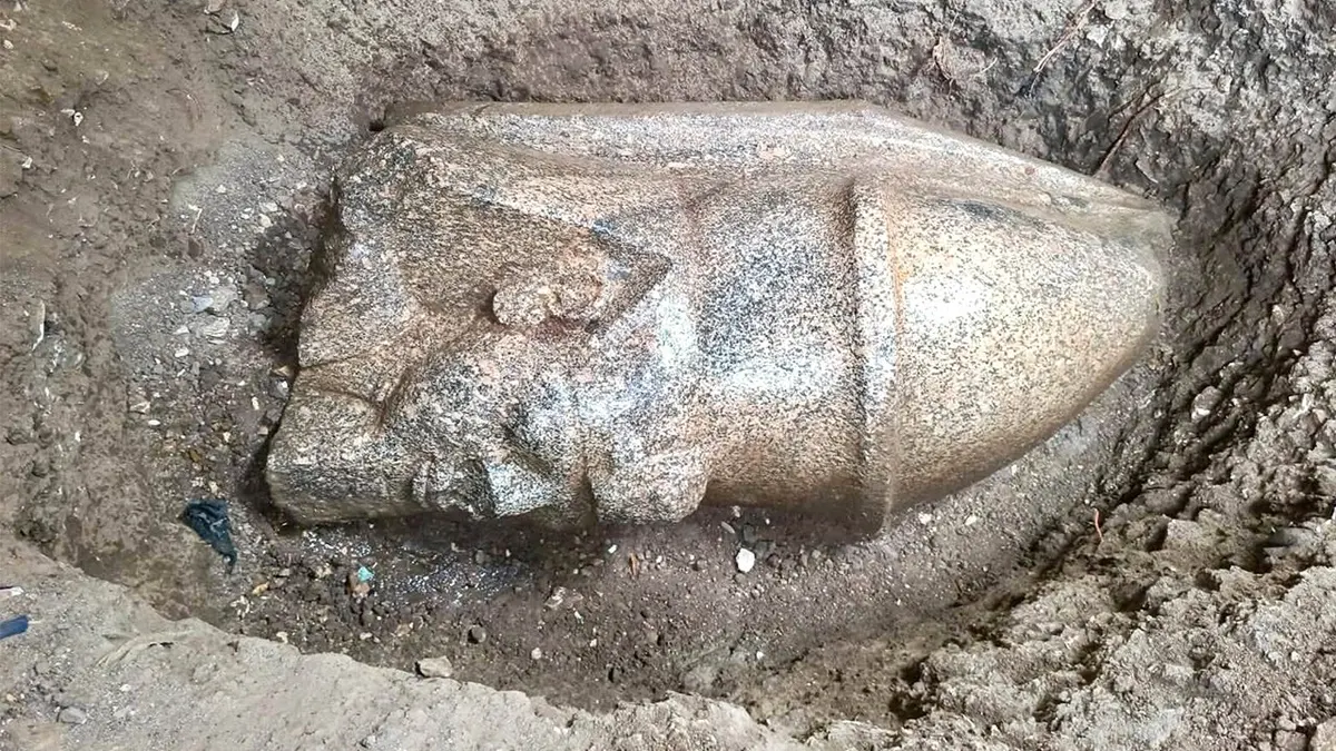 View of ramses ii statue in ground
