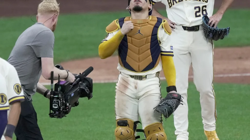 Milwaukee Brewers catcher William Contreras (24) reacts after their NLCS game as pitcher Aaron Ashby (26) looks on Monday, Oct. 12, 2026 at American Family Field in Milwaukee, Wisconsin. The Milwaukee Brewers beat the Los Angeles Dodgers 7-4 to lead the series 2-0.