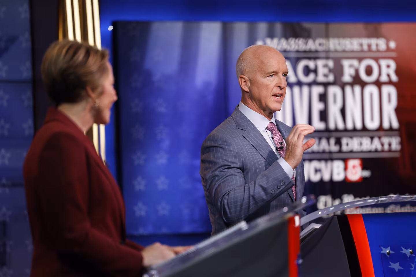 Republican gubernatorial nominee Michael Minogue spoke during a debate on Thursday against Governor Maura Healey, left.